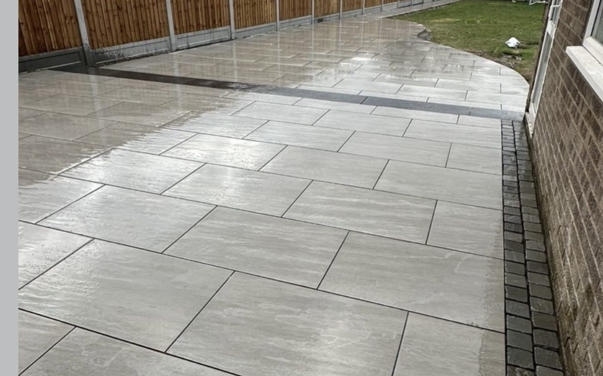 Large porcelain patio with a fenced border